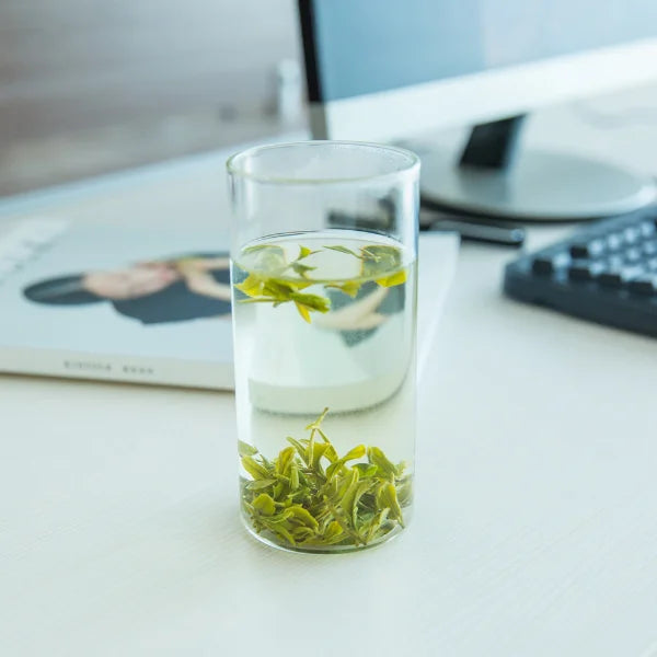 Close-up of premium green tea leaves with fine hairs